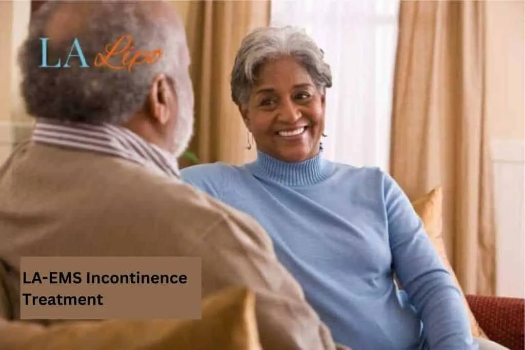 Couple sat smiling at each other - LA-EMS treatment Hampton Hill