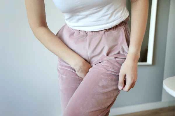 woman struggling with urine incontinence Hampton Hill